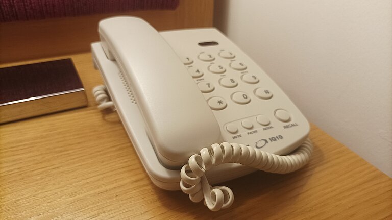 Wired landline push-button telephone