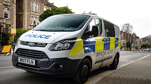 A police van parked on a street