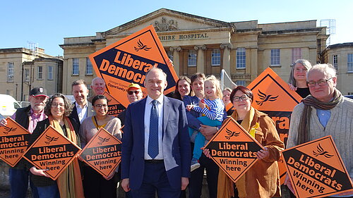 The Reading Liberal Democrats hold placards in front of the Royal Berkshire Hospital with party leader Sir Ed Davey MP