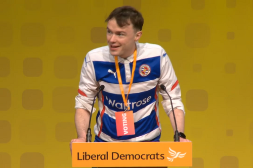 Henry Wright, Lib Dem Candidate for Reading Central, addresses the Lib Dem Conference wearing a Reading FC strip